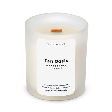 The Wick of Hope Zen Oasis Candle—Grapefruit + Sage—is an 8 oz white frosted glass candle with a wooden wick, crafted with coconut soy wax for a calming, spa-like atmosphere.