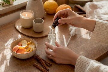 Hands preparing non-toxic room spray
