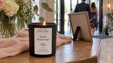 Fresh Beginnings candle on a wedding welcome table