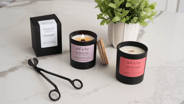 Hand-poured coconut soy candle from a give-back candle brand burning softly with a wooden wick