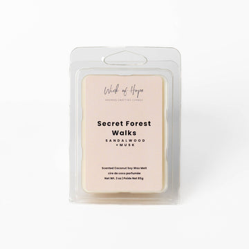 Secret Forest Walks Wax Melt in an rPET clamshell — sandalwood and musk, formulated without pet-irritant essential oils.