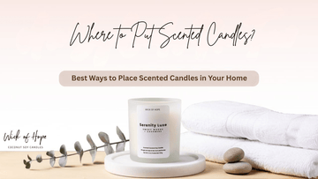 A scented candle styled on a tray in a softly lit room