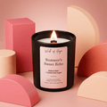 Candle labeled 'Summer's Sweet Echo' by Wick of Hope on a pink background with geometric shapes.
